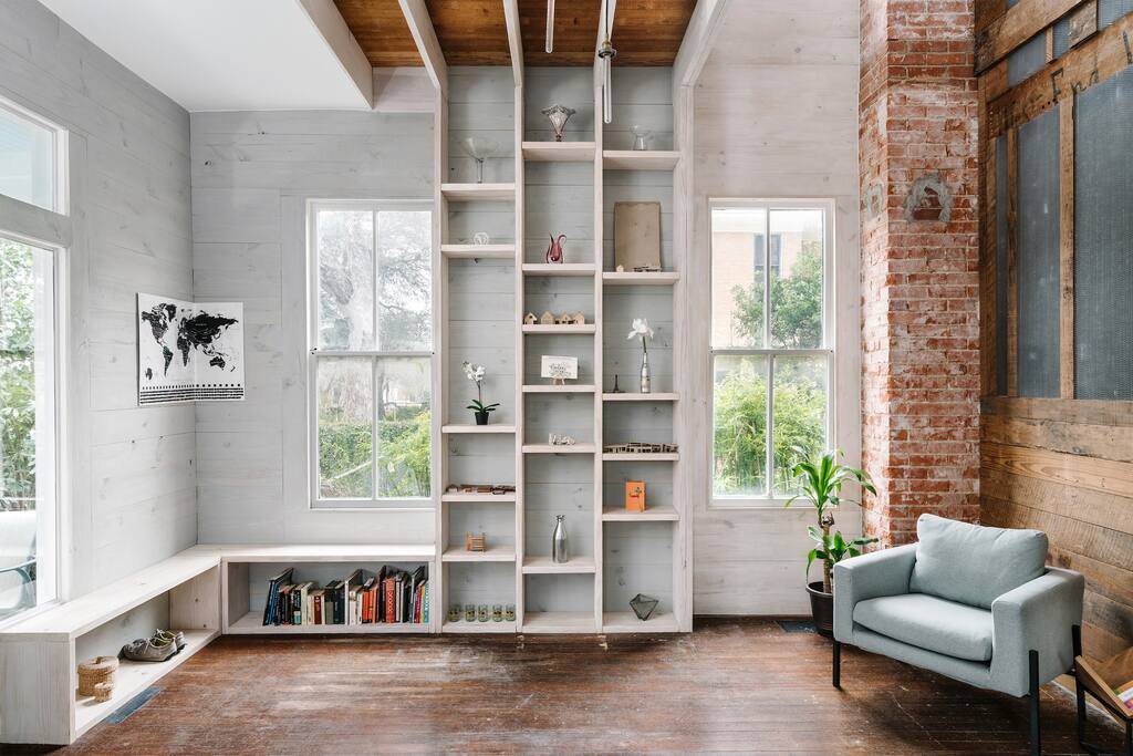 Entry sitting room with custom architectural details, open to above.