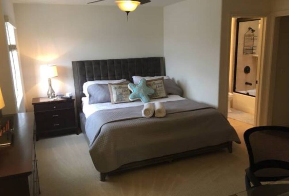 King bed with new mattress and clean bedding
