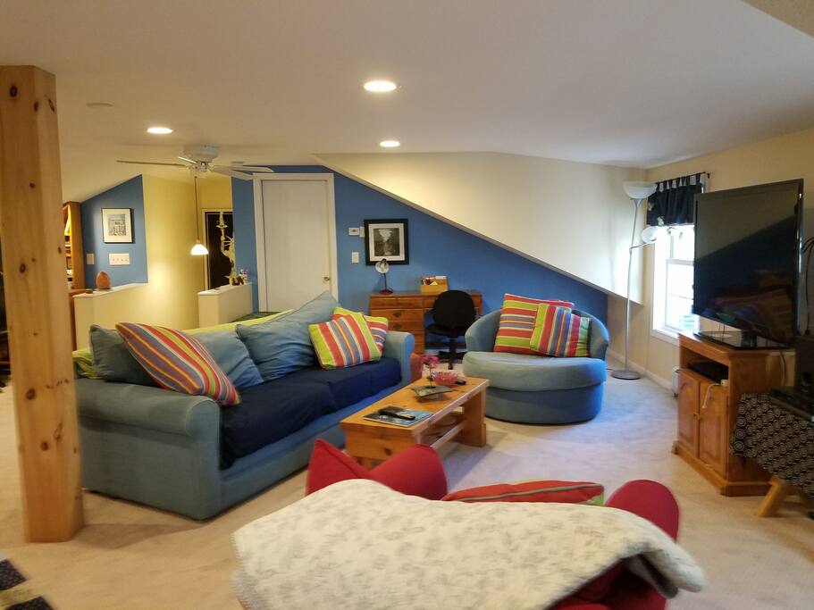 Sitting area, desk and large screen television