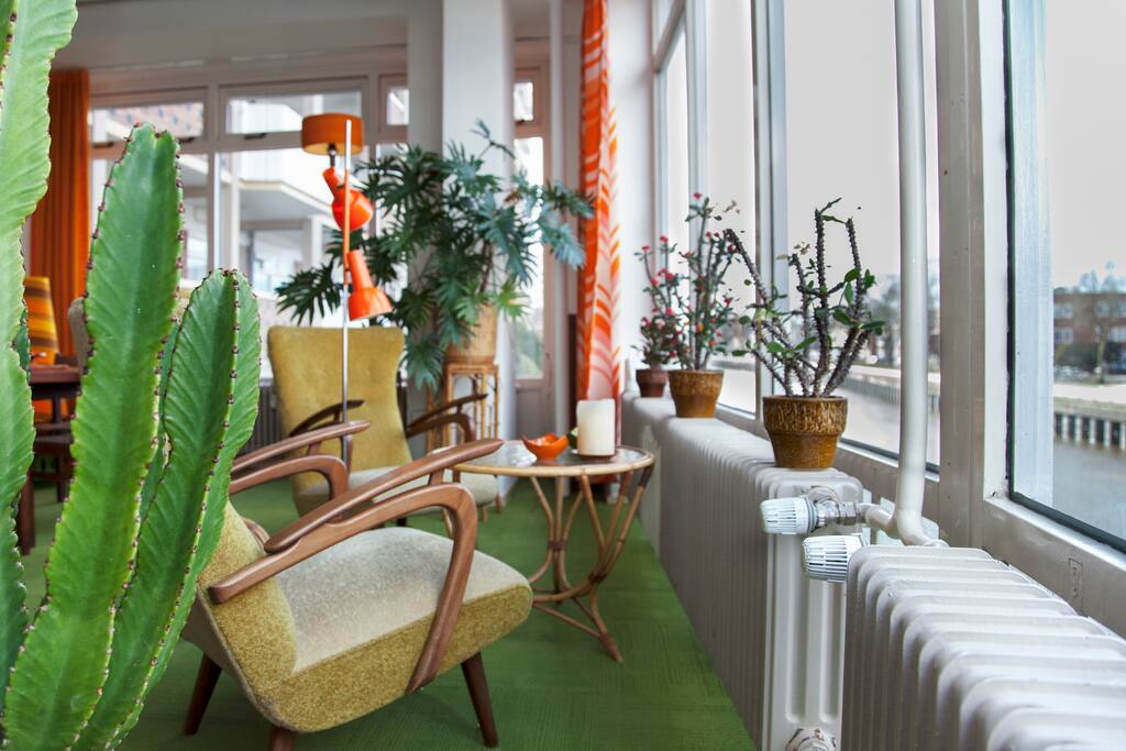 room with a panoramic view over the canal and city