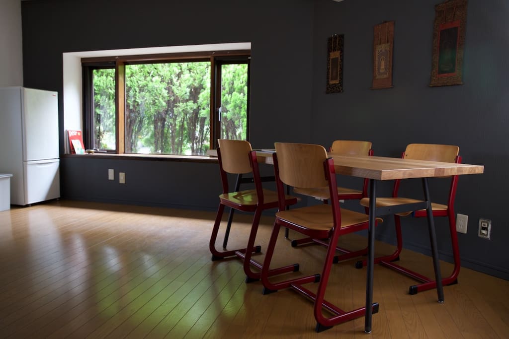 Spacious kitchen and wooden table good for eating, talking, and writing