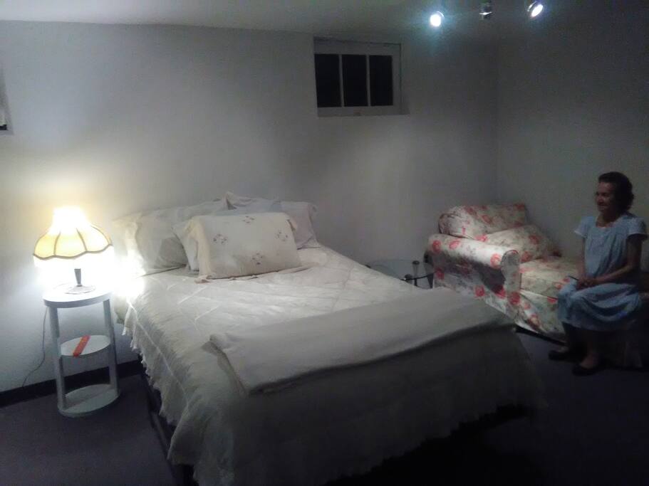 Queen size bed , chaise lounge on right