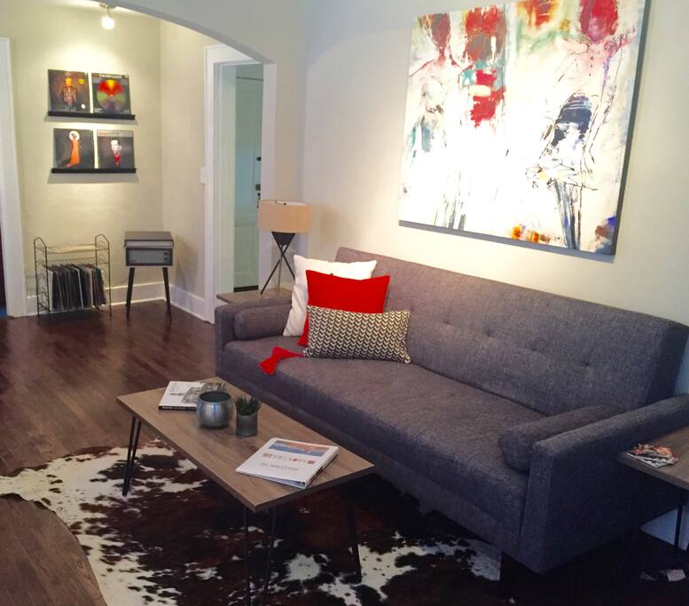 The couch converts into the third bed. You'll love the Crosley record player!