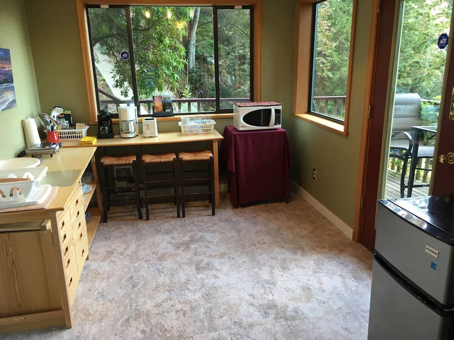 The kitchenette is a separate room; door to deck and entrance to the suite.