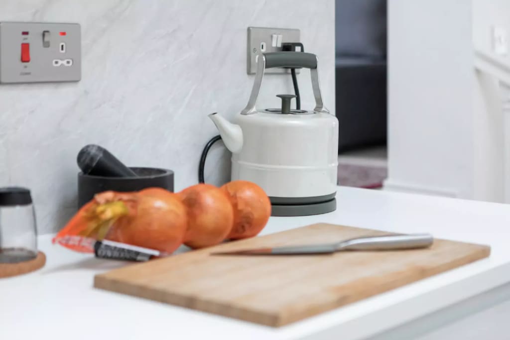 Kitchen: chopping board, and kettle