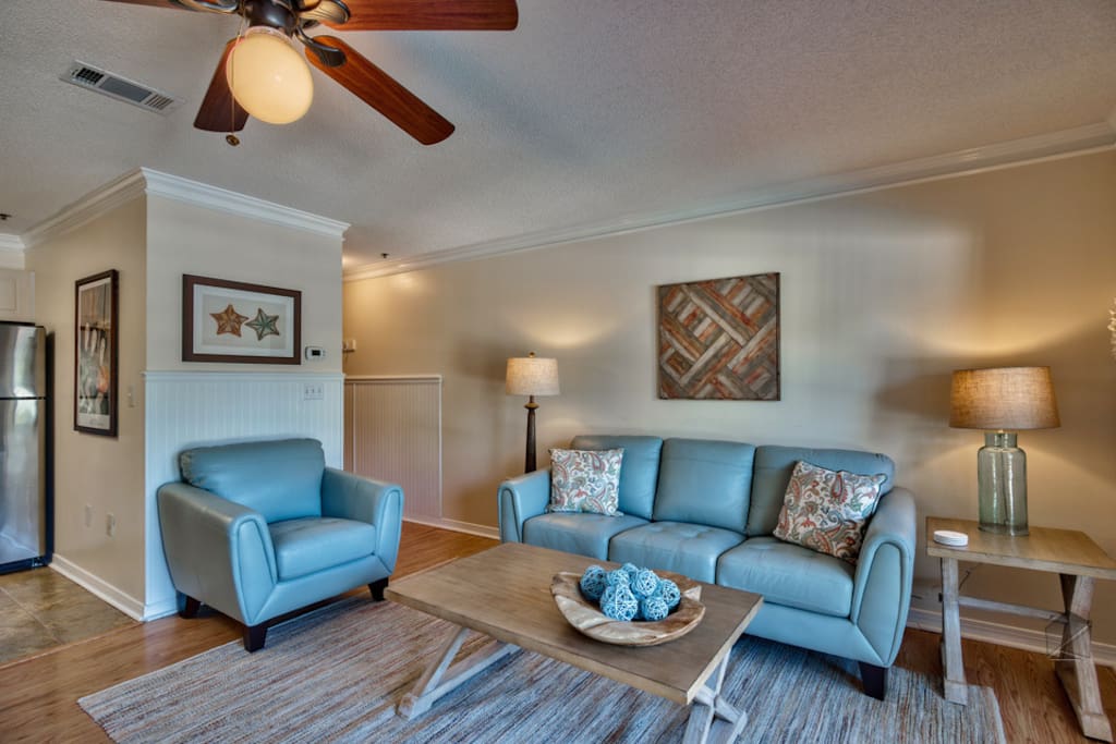 The living room is well appointed and features a comfy sofa.