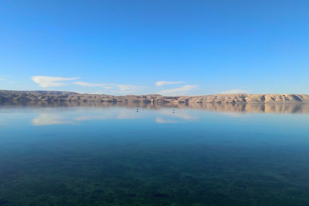 Beach view on rocky island of Pag