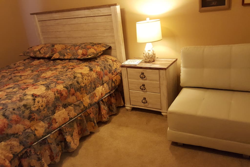 Guest bedroom 2 with fold down chair for child's bed.