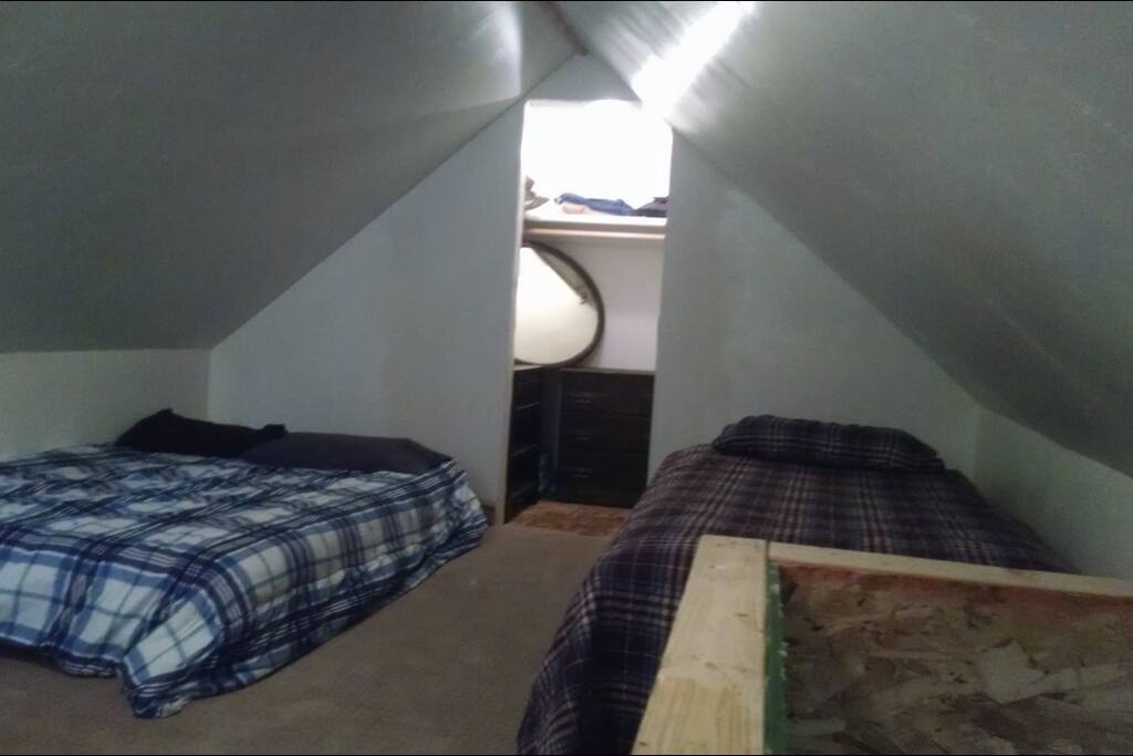 Here's a photo of the loft showing a full and twin size bed with closet space.