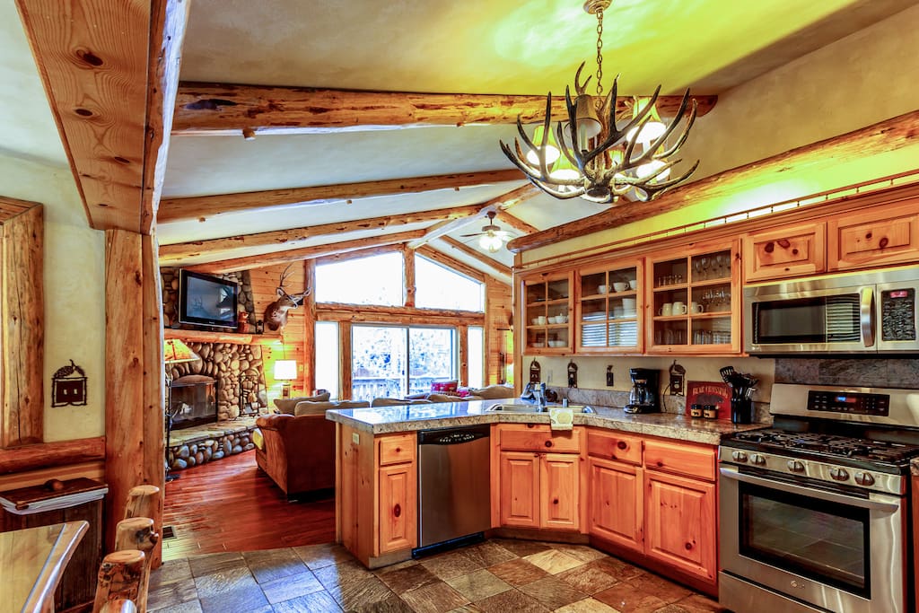 Front entry through the kitchen, with 6 person log dining set