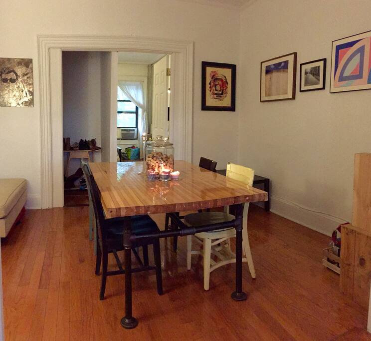 The dining room features a 6-seater custom bowling alley dining table.