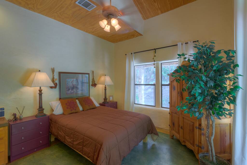 1st level Queen bedroom adjacent to library (photo1) with private talavera sink.