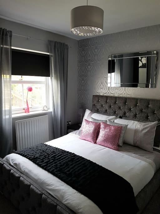 cosy bedroom with kingsize bed memory foam mattress and protector also has single wardrobe ,dressing table,hair dryer and fan .