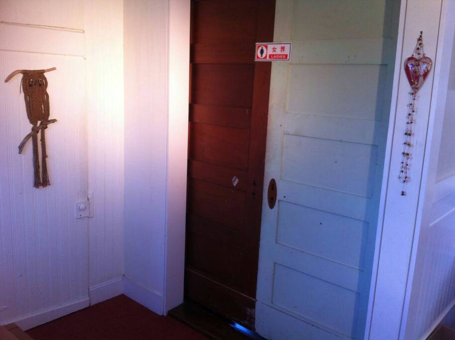 Door to 1/2 bath on the left and bedroom on the right.