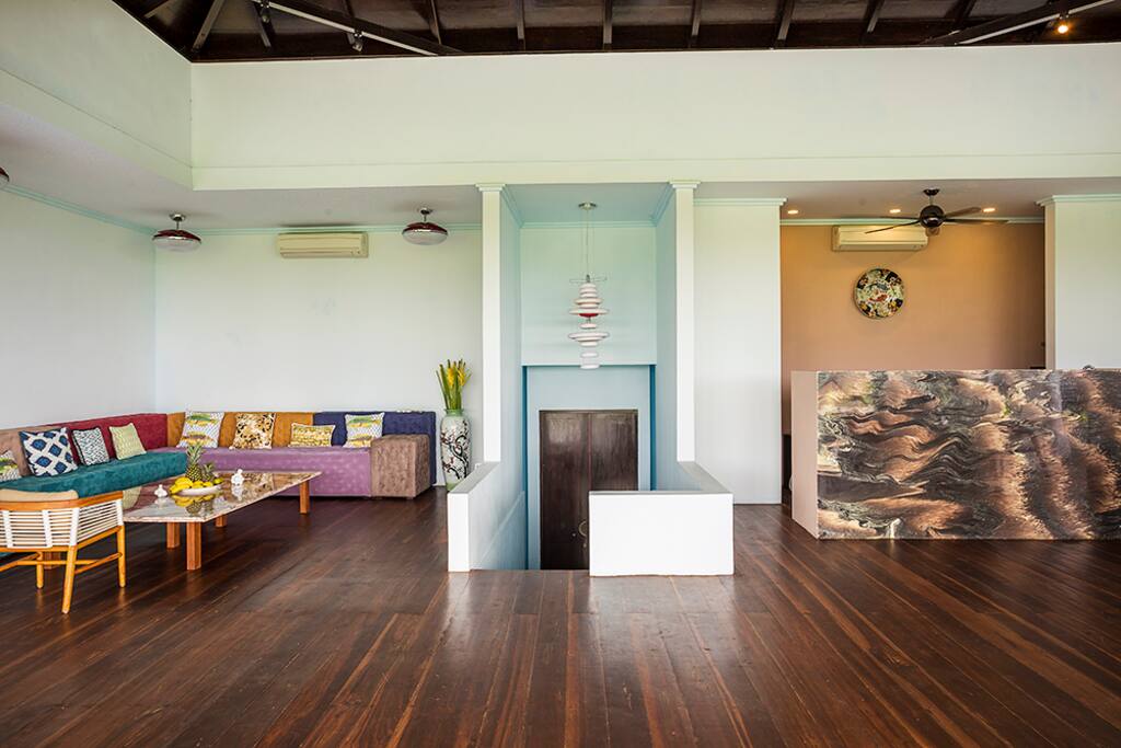 Open space of living room and main kitchen. Entrance to villa from parking area.