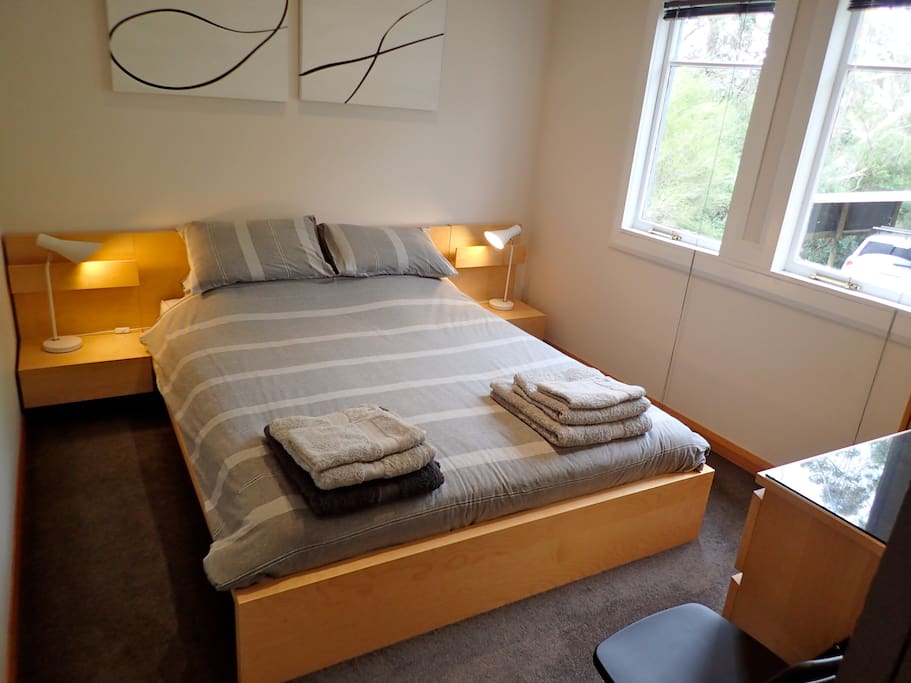 Bedroom with queen sized bed.