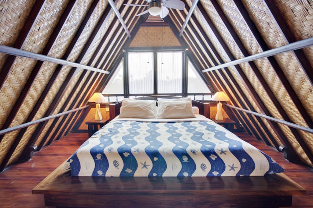 The funky Lumbung inspired Balinese bedroom on the second story of your villa