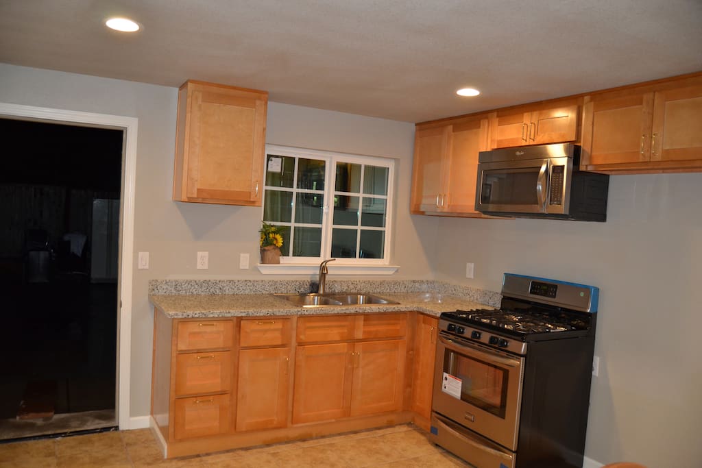 Kitchen with stainless steel double sink and appliances