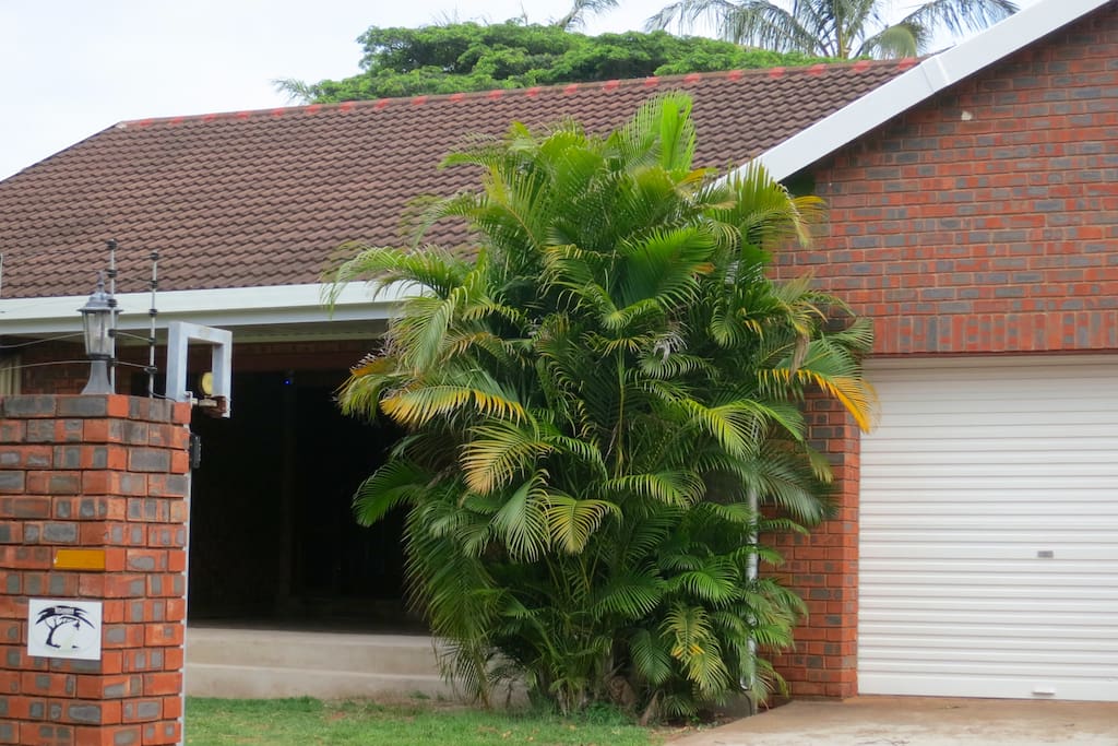 Front of the property has 2 double garages and is secured by a wall with an electric fence. There are also security beams and slam lock doors.