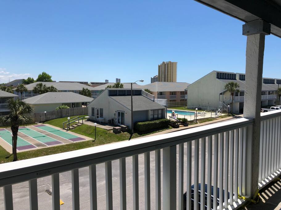 view of pool and courts