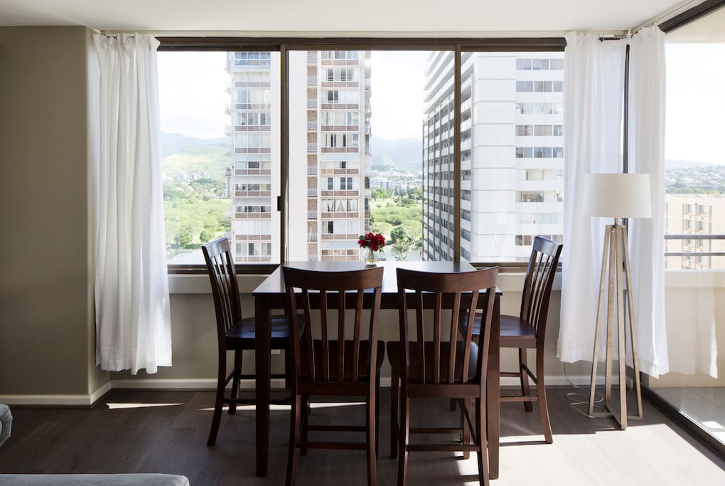 Watch canoes paddle down the canal from your mountain view dining table