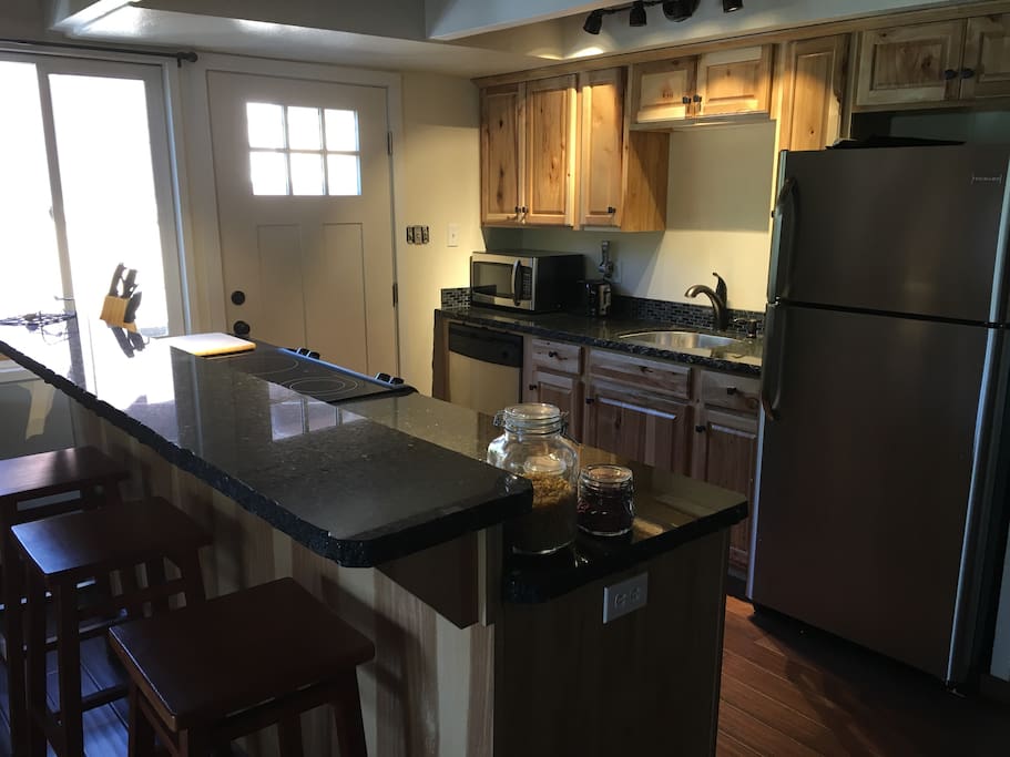 Fully remodeled kitchen with granite counters.
