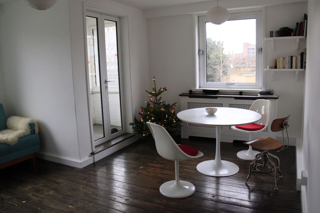 Bright and spacious living room with beautiful 60s design furniture