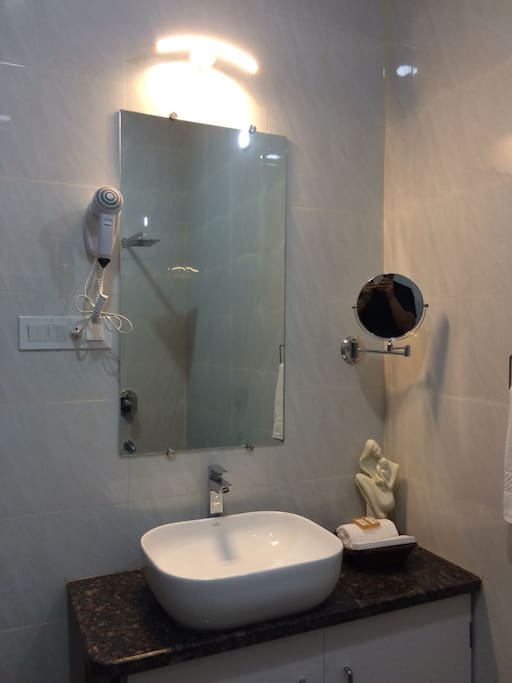 Clean, large and luxurious bathrooms with Hair Dryer and Shaving Mirror