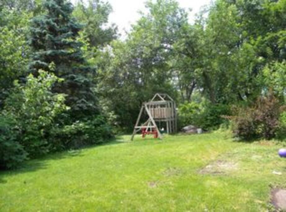 A view of the fenced in backyard