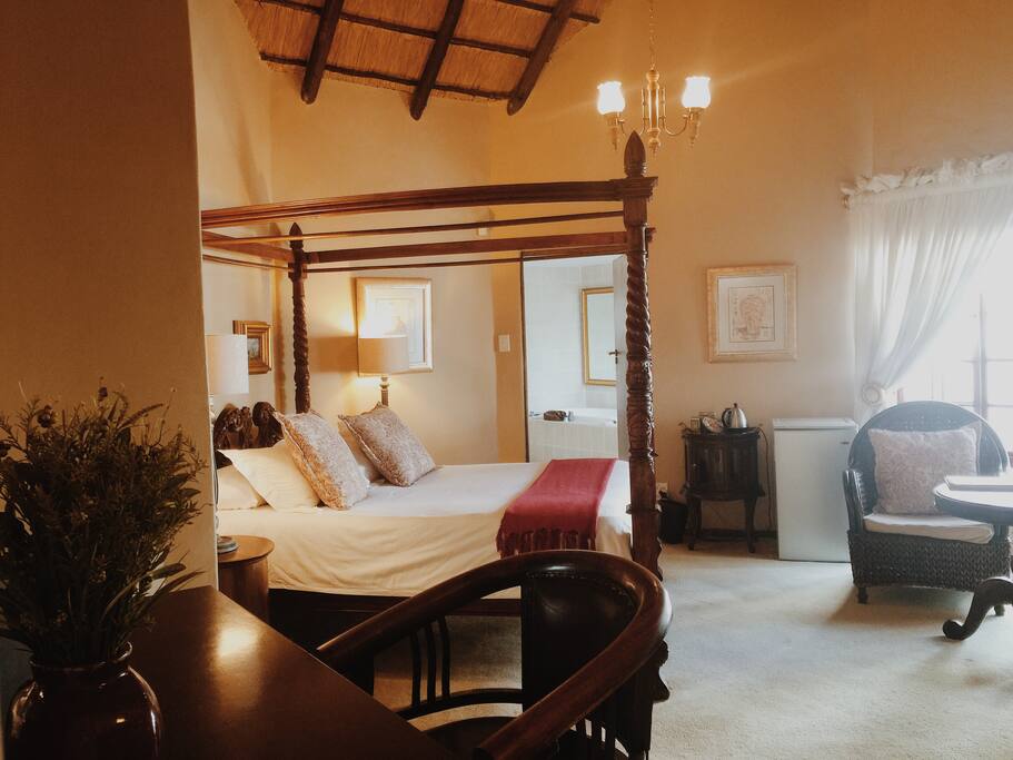 Working desk, mini lounge, bar fridge, coffee/tea facilities & flat screen TV.