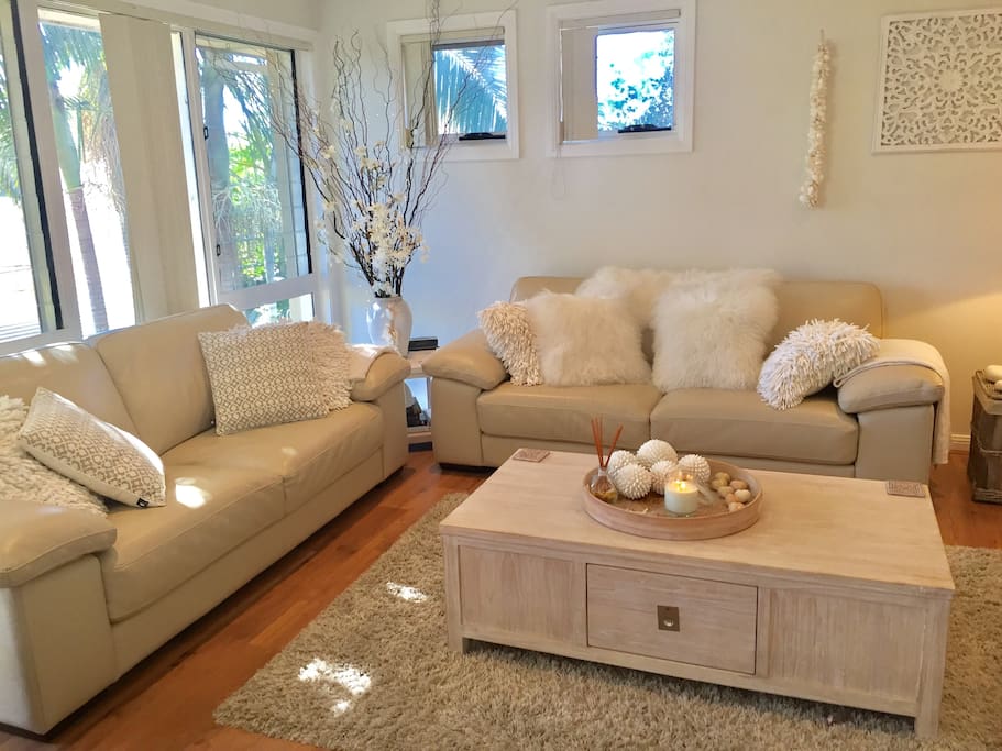 Relax in this stunning living area decorated in a white colour palette