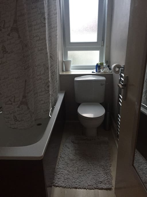 Modern bright bathroom with bath and shower