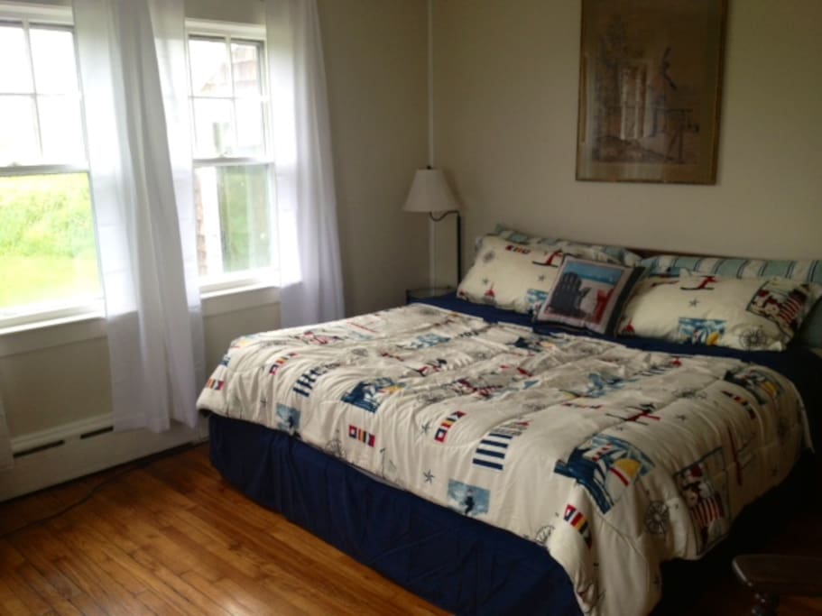Bedroom with King size bed and windows on 2 sides
