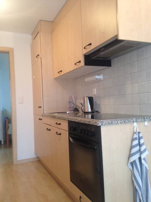 Kitchen with stove and fridge