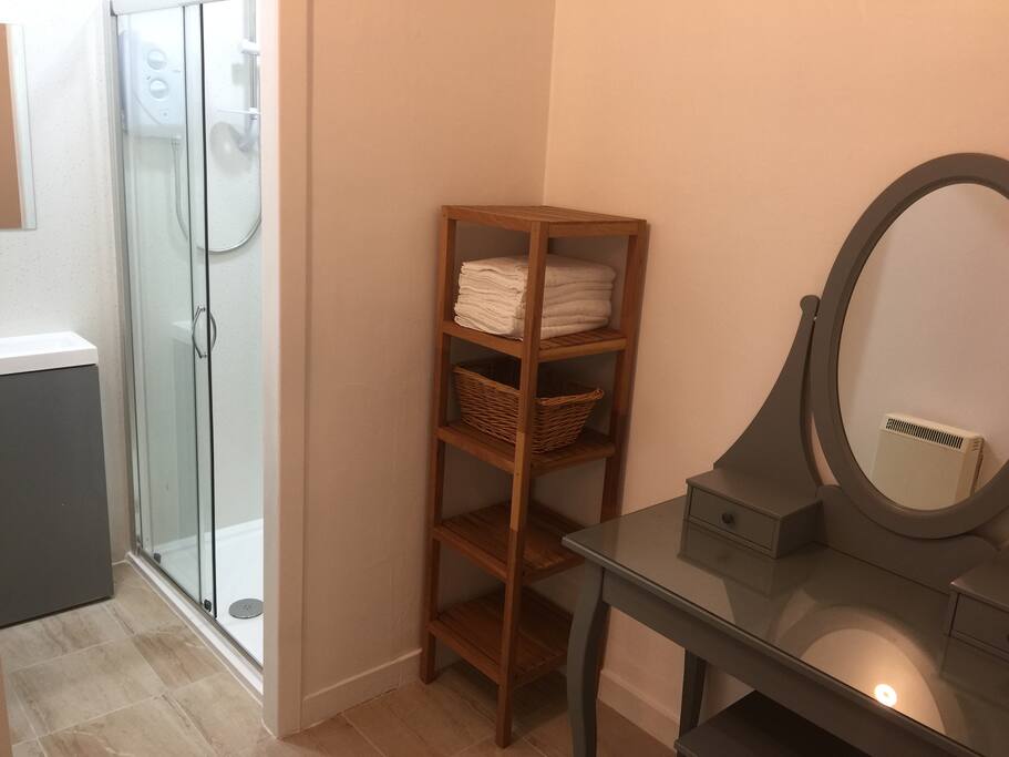 Shower room with changing room attached.