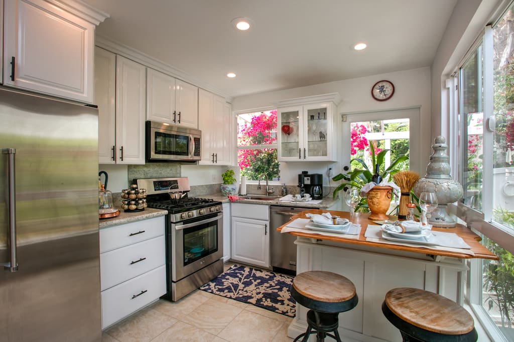 Stunning and functional, the kitchen features granite countertops for plenty of prep space.