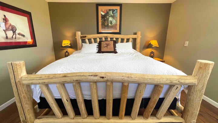 Beautiful handmade King log bed with duvet bedding set. Duvet cover set and sheets are always washed between groups. 