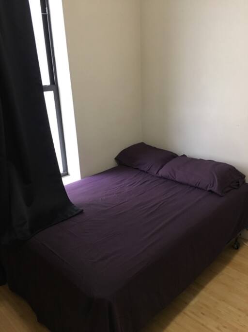 Clean sheets in sunlit room