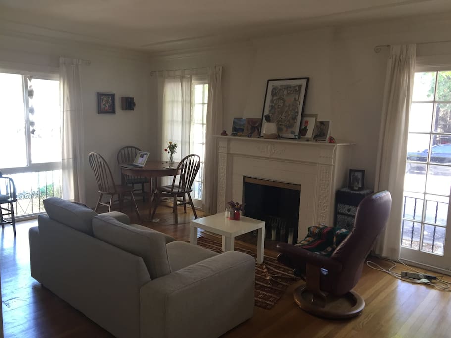 Spacious living room with hardwood floors and lots of natural light