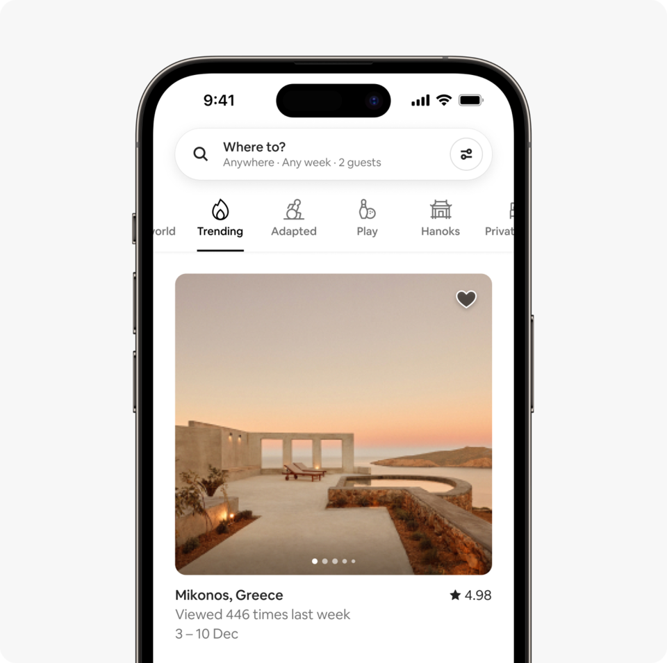 A laptop and a phone show the Airbnb homepage with two rows of homes from a new Airbnb November Release category called Trending, which features homes that are getting a lot of views recently.