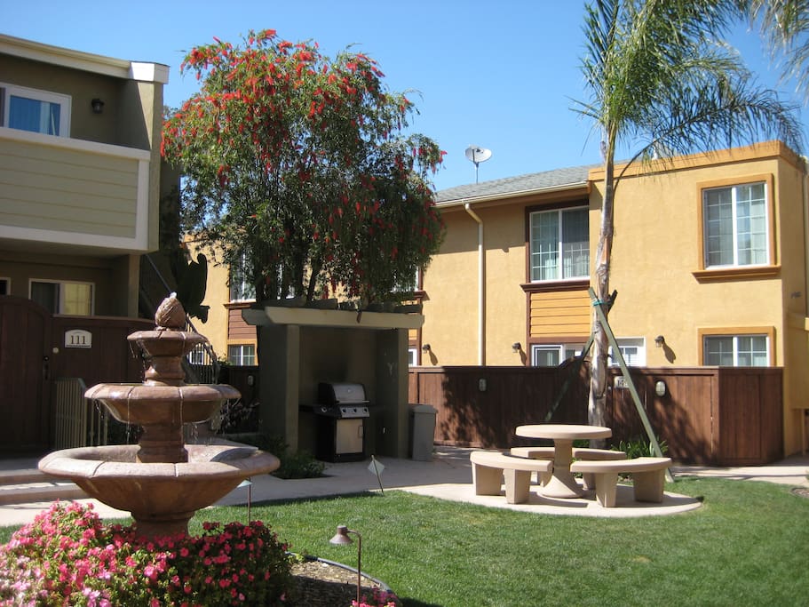 Community area with BBQ and picnic table