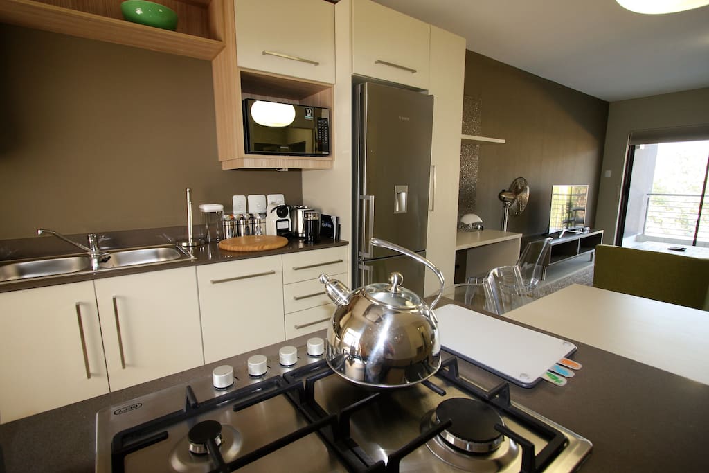 Appliances include a fridge, washing machine, dishwasher and dryer