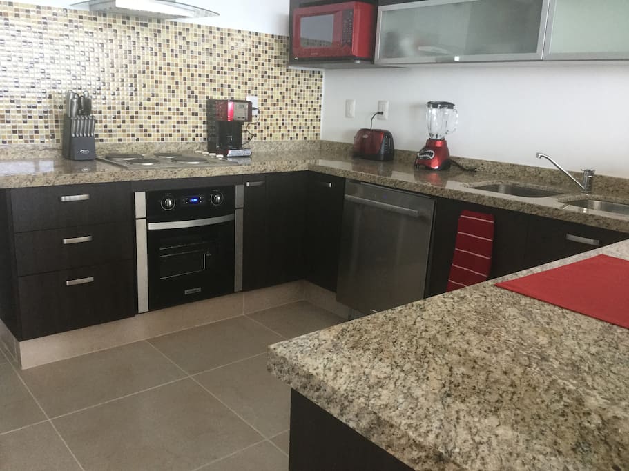 Large, functional kitchen with all amenities needed to cook.