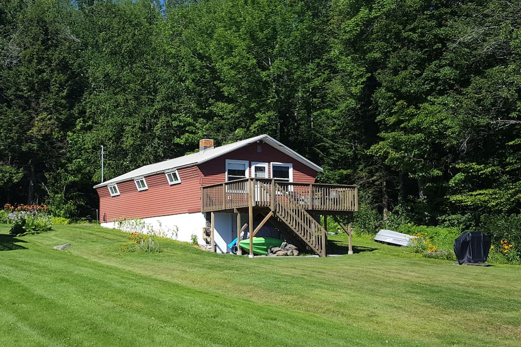 The deck offers outdoor dining, great views, and easy access to the lake.