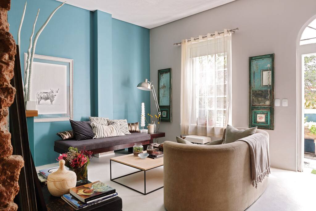 The living room. The mirrors are antique ones from Goa.