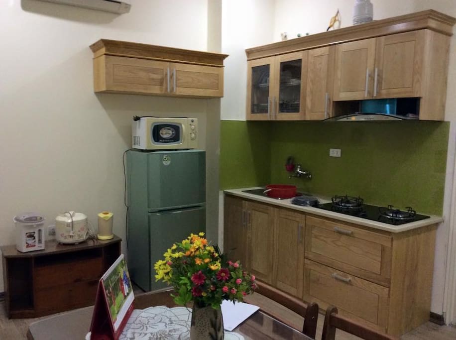 Kitchen with rice cooker and other cooking utensil