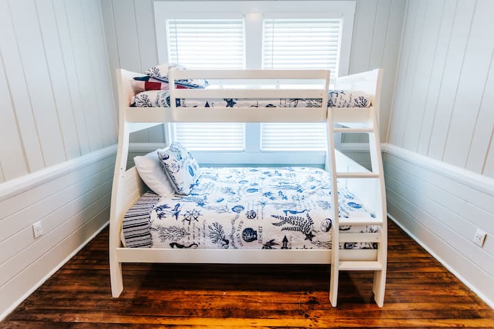 Middle bedroom with a twin bed up top and a full on the bottom