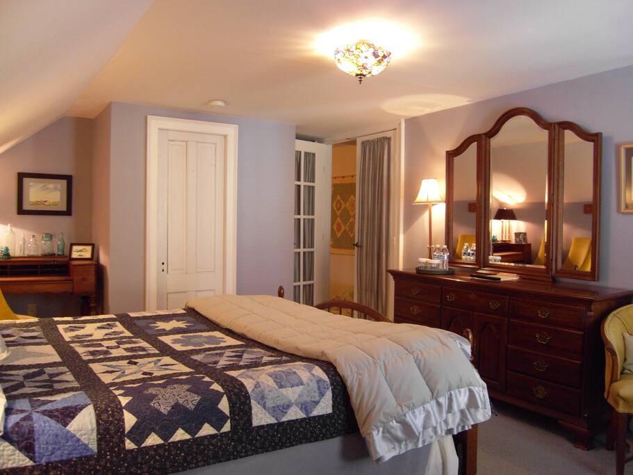 Guests may unpack. Triple dresser provides space for clothing items.
