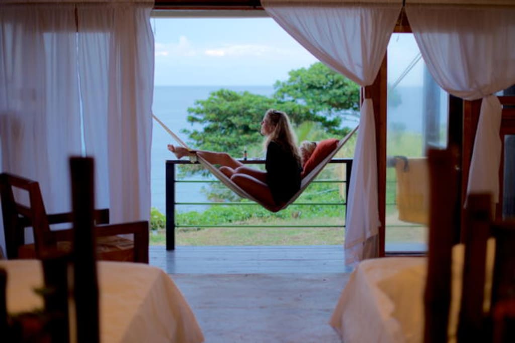 Listening to the ocean's music on your private balcony.