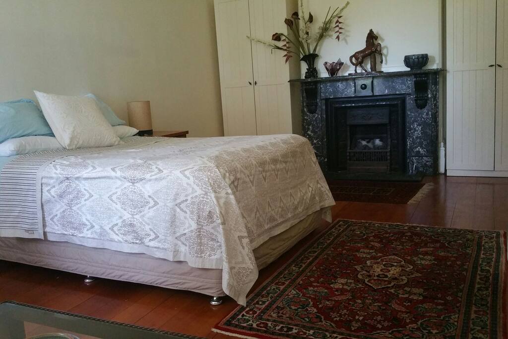 The bedroom is large with a marble fireplace at one end and Bay windows at the other.This is the bedroom in this booking.